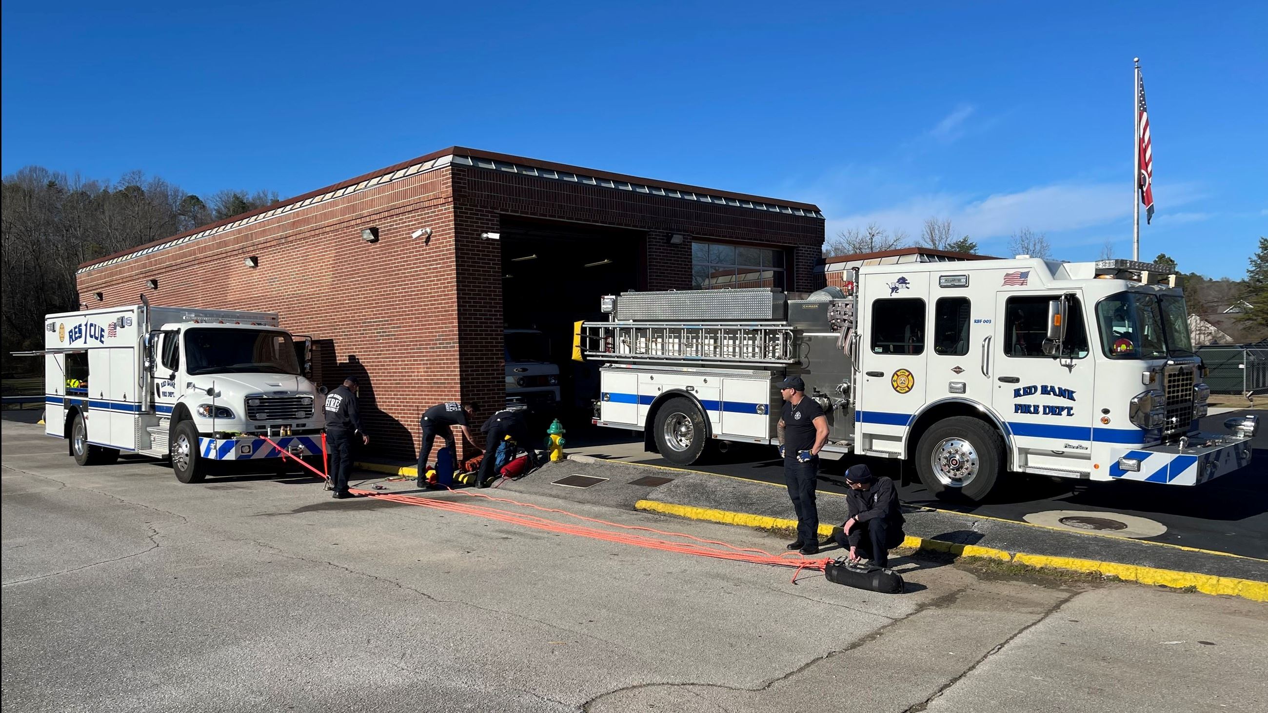 Firefighters training with rope equipment